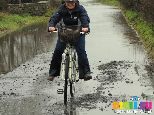 SX17151 Jenni cycling through flooded road
